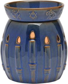 a blue vase with gold accents on it