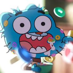 a cartoon character holding a toothbrush in his mouth and looking at the camera lens