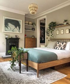 a bed sitting in a bedroom next to a fireplace