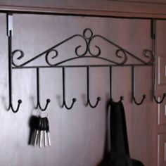 there is a coat rack with hooks on it