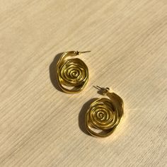 Introducing the Izzy Swirl Earring! Embrace a unique and stylish look with its elegant swirl design. Add a touch of artistry to your outfit and make a statement that will surely turn heads. Elevate your fashion game with these versatile earrings. 18K Gold Plated Over Stainless Steel Hypoallergenic Water & Tarnish Resistant All SALE items are FINAL sale Brazilian Gold, Swirl Earrings, Wedding Jewellery Collection, Sunglass Chain, Jewelry Studio, Swirl Design, Original Gift, Cz Stone, Jewelry Care