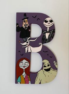 the letter b is decorated with halloween images and characters, including jack - o'- lanterns