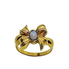 Bow Ring W/Faux Opal, Gold Tone Metal By Avon Circa 1980s Size: 8.75 Materials: Ceramic Hallmark: Avon Nwot Offers Welcome!!! Bx0801103 Avon Rings, Bow Ring, Avon Jewelry, Womens Jewelry Rings, Gold Tone Metal, Blue Gold, Hallmark, Gold Tones, Opal