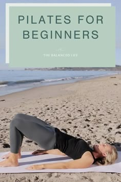 a woman doing yoga on the beach with text overlay that reads pilates for beginners