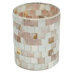 a white vase with pink and brown tiles on it's sides, sitting in front of a white background