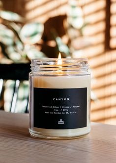 a candle sitting on top of a wooden table