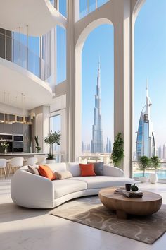 a living room filled with white furniture and tall buildings in the backgroung