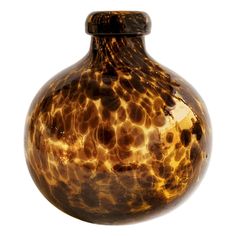 a brown and black vase sitting on top of a table