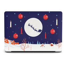 a laptop computer with a christmas scene on it