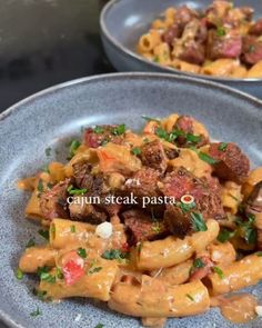 two plates filled with pasta and meat on top of a table next to each other