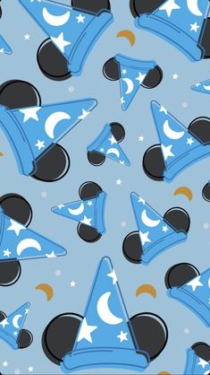 a blue and black pattern with stars, hats and crescents on it's sides