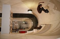 a man riding a skateboard up the side of a ramp