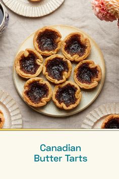 the cover of canadian butter tarts is shown on a table with plates and cups