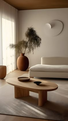 a living room with a couch, coffee table and potted plant