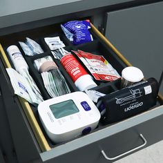 an open drawer with medical supplies in it