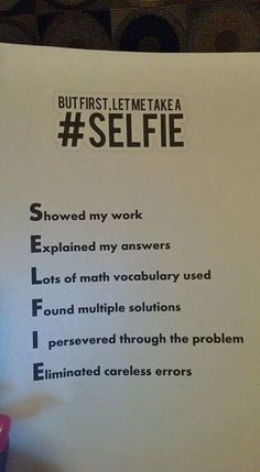 a hand holding a piece of paper with instructions for selfie written on the side