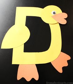 the letter d is made out of construction paper and cut into two different shapes to make it look like a duck