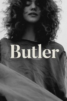 a black and white photo of a woman with her hair blowing in the wind, text butler