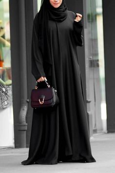 Grab this casual day to day abaya with seamless pockets! Customised in 10+ colors! Crafted in premium nidha quality assured. Look classy with this casual abaya.comes with a hijab! Burkha Designs, Abaya Noir, Black Abaya Designs, Simple Abaya, Casual Abaya, Abaya Design, Casual Attire For Women, Black Abaya, Abaya Style