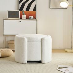 a white chair sitting on top of a carpeted floor