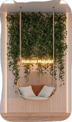 a hanging chair in front of a wall with plants growing on it and the words haukund material above