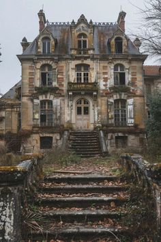 an old building with stairs leading up to it