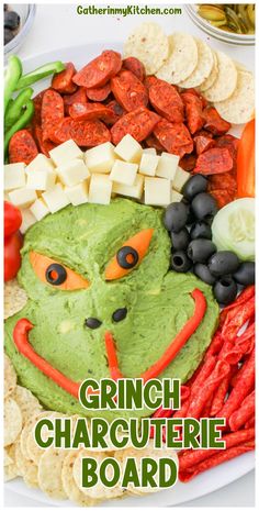 the grin face is made out of vegetables and crackers on a plate with text overlay