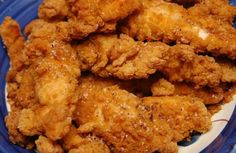 fried chicken pieces on a blue and white plate