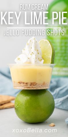 key lime pie jello pudding shots with whipped cream and limes in the background