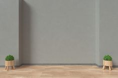 two small wooden planters sitting on top of a hard wood floor