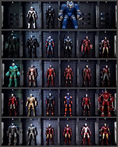 a display case filled with different types of action figures in plastic cases, all lined up on top of each other