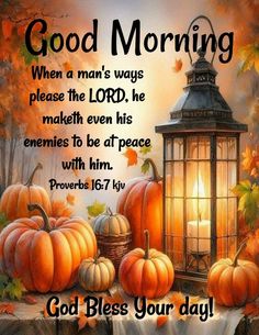 a lantern and pumpkins on a table with the words good morning written below it