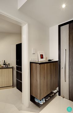 a modern kitchen with white tile flooring and wooden cabinets