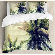 an image of a bed with palm trees on it