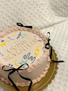 a birthday cake with the words happy birthday on it sitting on top of a table