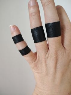 "Tiny faux leather finger band ring in black - visit my shop for more designs and colors  Medium thickness, matte, textured. Single layered. Handbands, wrist cuffs, wrist wraps - visit my shop for more color matching accessories *Sold as one ring *Handmade with love and care in a smoke free home *Every finger band is sewn by me *Single layered  *Ideal for covering finger tattoos *Stretchy and soft faux leather *Medium thickness, matte, textured faux leather *Fabulous accessory for your outfit *G Leather Rings, Teen Ring, Finger Band, Wrist Wraps, Tattoo Cover Up, Gothic Tattoo, Tiny Rings, Tattoo Cover, Tattoo Cover-up