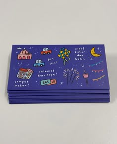 several purple cards with pictures of fireworks, buildings and cars on them that say happy new year