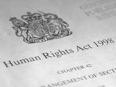 a human rights act document is shown in black and white