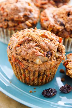 a blue plate topped with muffins and raisins