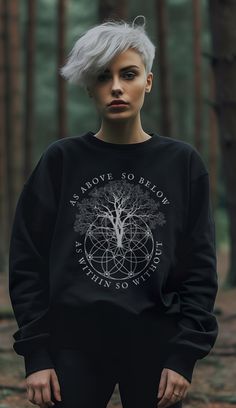 Get 10% off your first order: join.lucidamystica.com As Above So Below with tree and sacred geometry occult graphic on a super-soft and cozy sweater to keep you warm in the colder months. Plus sizes available for a roomy fit. Perfect lounge staple for yourself or as a gift for your favorite magickal human! Size up for an oversized aesthetic look. Size chart found in images.  * 50% cotton, 50% polyester * Pre-shrunk * Classic fit with no center crease * 1x1 athletic rib knit collar with spandex * Oversized Aesthetic, Alternative Aesthetic, As Above So Below, Aesthetic Look, Cozy Sweater, Unisex Tshirt, Gorgeous Design, Knit Collar, Sacred Geometry