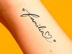 the word love is written in cursive writing on a woman's arm