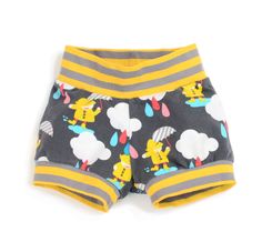 a child's shorts with yellow and grey stripes on the bottom, featuring cartoon characters