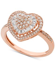 a rose gold ring with diamonds in the shape of a heart