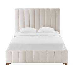 an upholstered bed with white linens and pillows on the headboard, in front of a white background