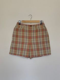 "Awesome high waisted 90's plaid shorts. High waisted fit, looser through the hips, and two front pockets. Button and zipper closure in front. Classic 90's multi colored plaid pattern. Shorts are in excellent clean condition. Measurements are taken zipped or buttoned up and laid comfortably flat then x 2 for total circumference (inches) Liz Claiborne Tag Size 10 100% Cotton Waist 28\" Hips 42\" Length 16.5\" Inseam 5\" Rise 12\" Bottom leg Opening Circumference 26\" All items are free of rips, t Plaid Bottoms With Built-in Shorts, High-waisted Plaid Bottoms With Built-in Shorts, Retro Plaid Bottoms For Spring, Vintage Plaid Bottoms For Summer, Vintage Plaid Summer Bottoms, 90s Style Shorts With Belt Loops, Vintage High Waist Plaid Bottoms, High Waist Plaid Summer Bottoms, Retro Plaid Bottoms With Pockets