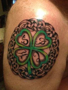 a man with a shamrock tattoo on his shoulder