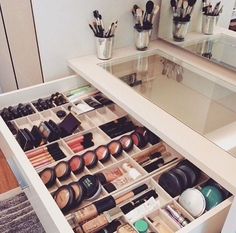 the drawers are full of cosmetics and makeup brushes