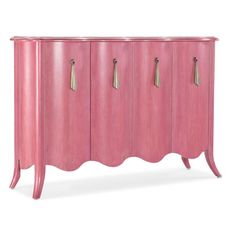 a pink cabinet with three doors and two handles