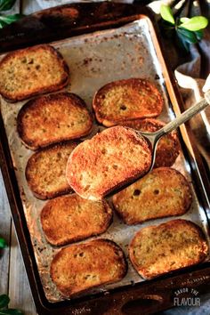 a pan filled with baked goods on top of a wooden table