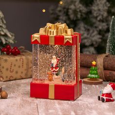 a christmas scene with santa clause in a snow globe